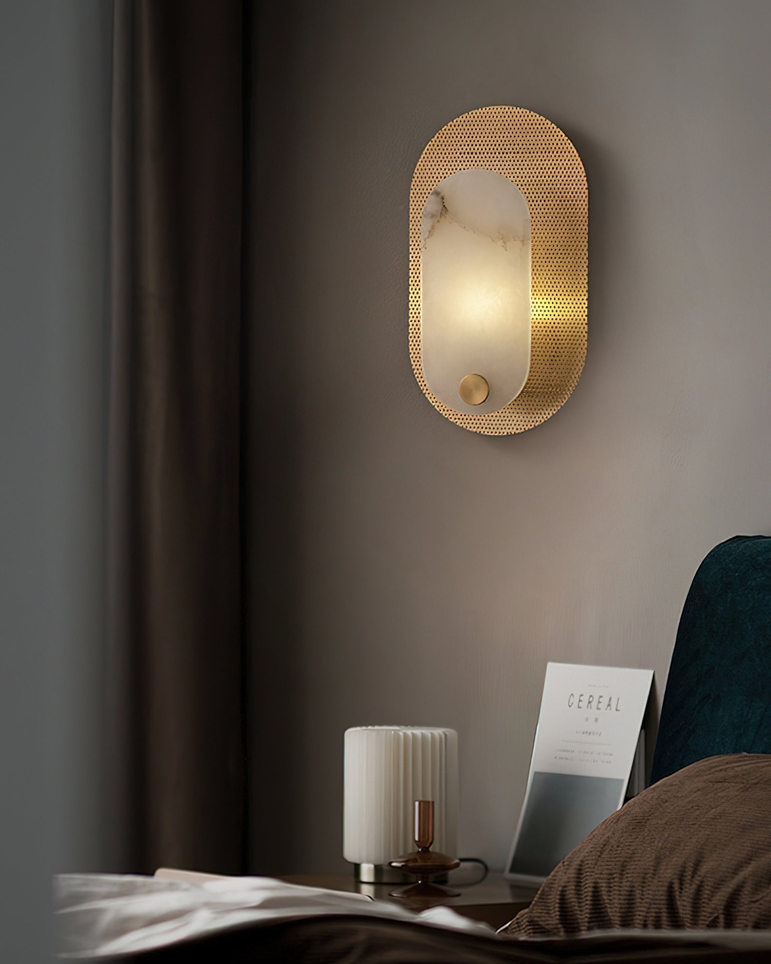 Detail of the gold finish on the metal fixture of the Vance Wall Lamp.