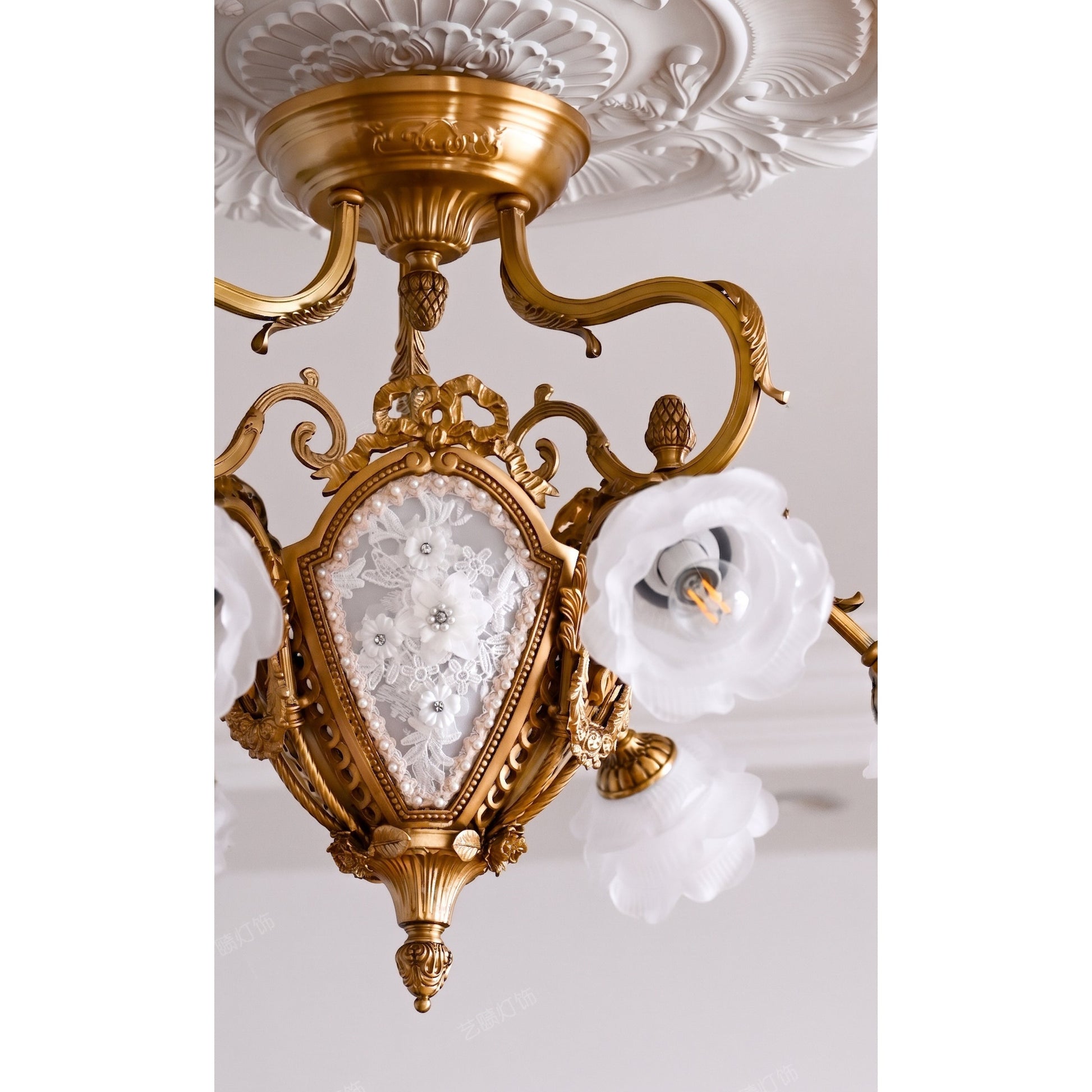 Close-up of the hand-chased details on the solid brass frame.