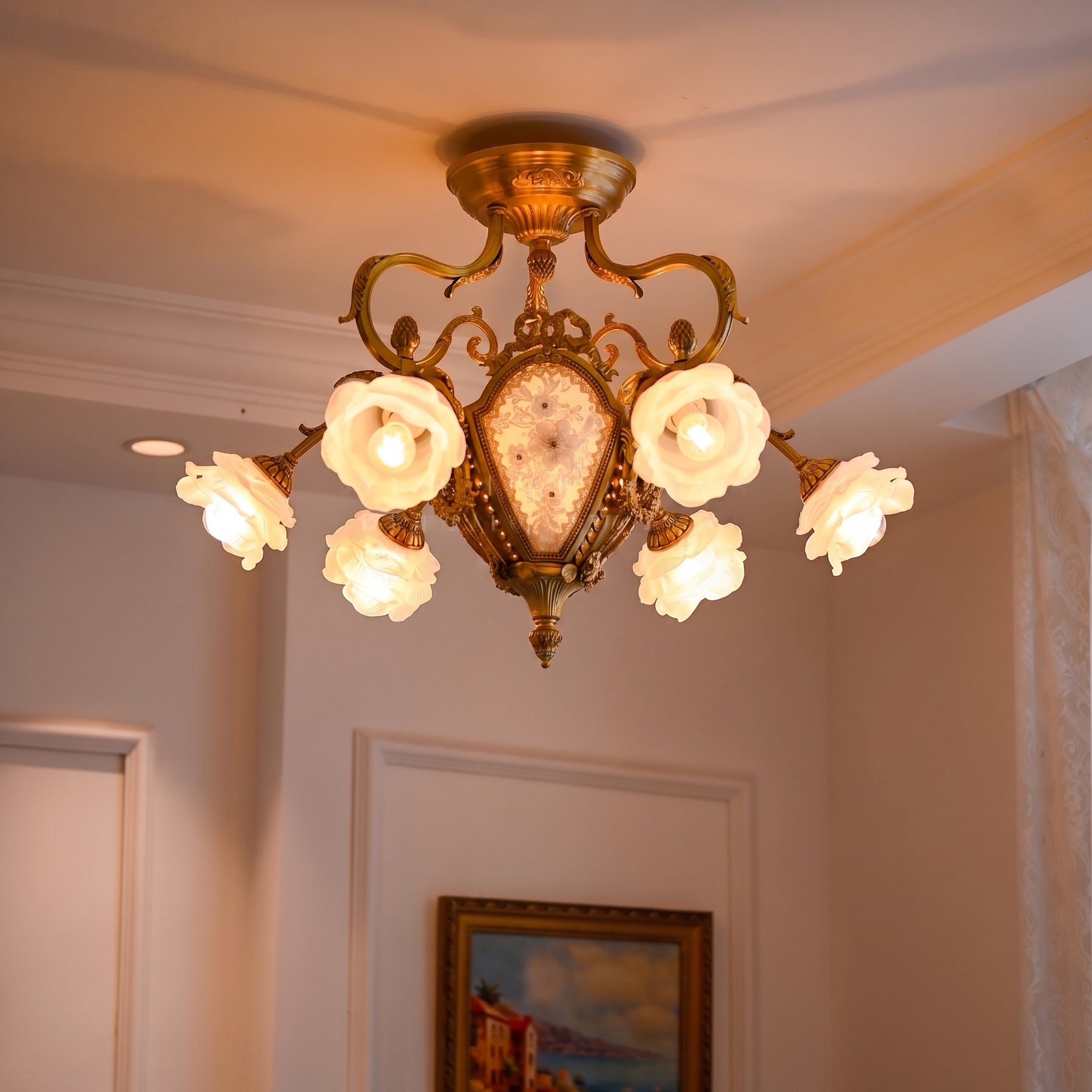Detailed view of the cast brass body and frosted glass rose shades.