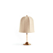Vanna Table Lamp with gold base and beige linen shade on a neutral background.