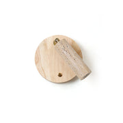 Veda Travertine Wall Lamp shown against a neutral wall.