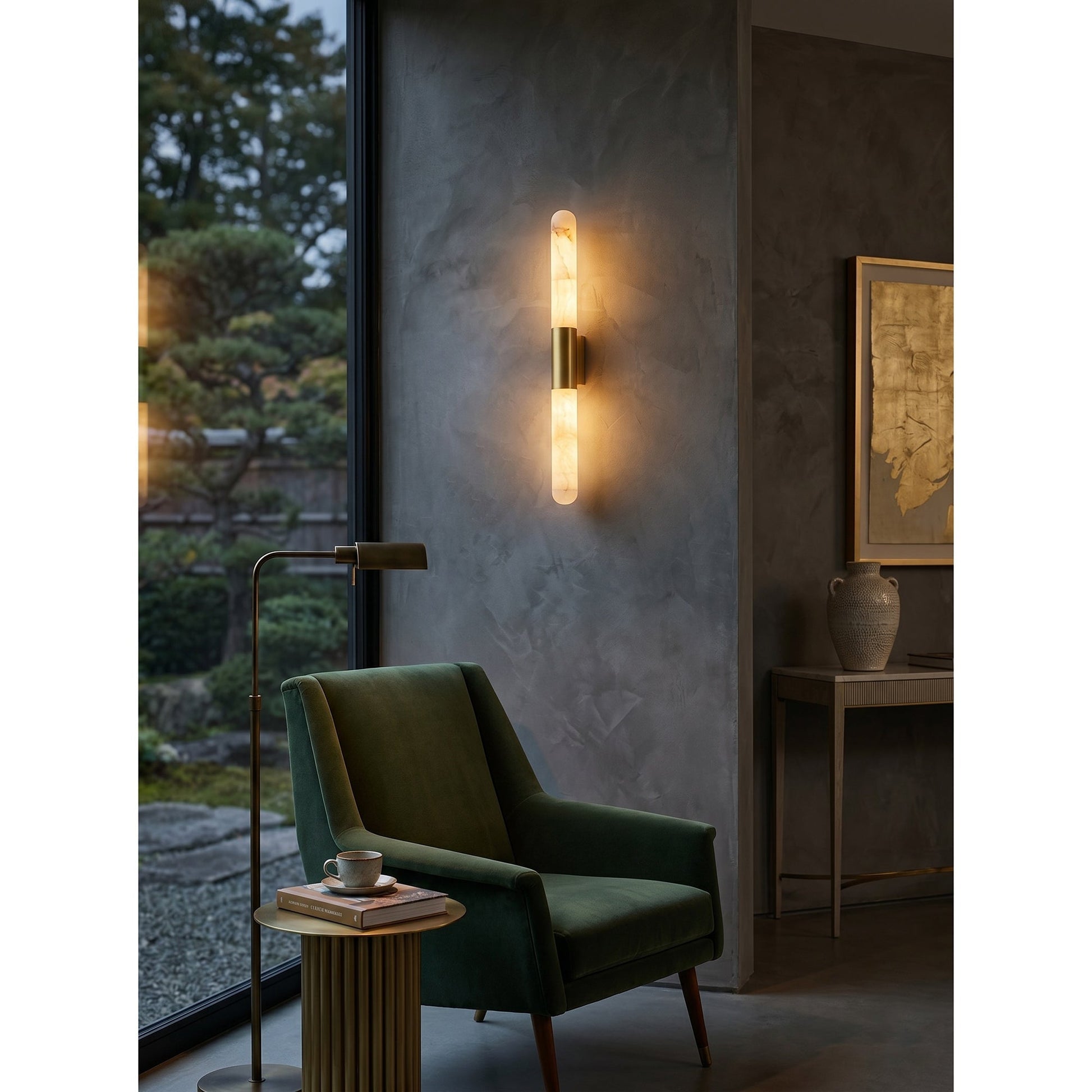 The tall version of the Velin wall sconce installed in a contemporary entryway.
