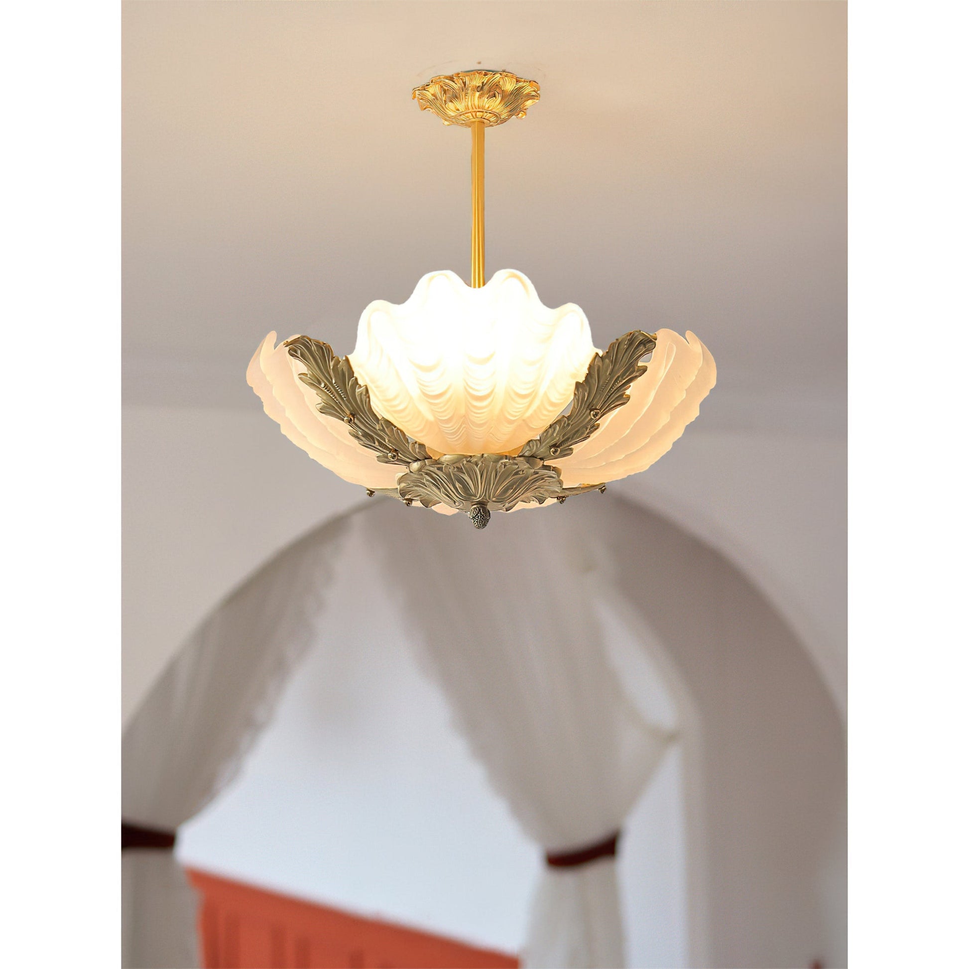 The pink Velmira lamp adding a pop of color to a room.