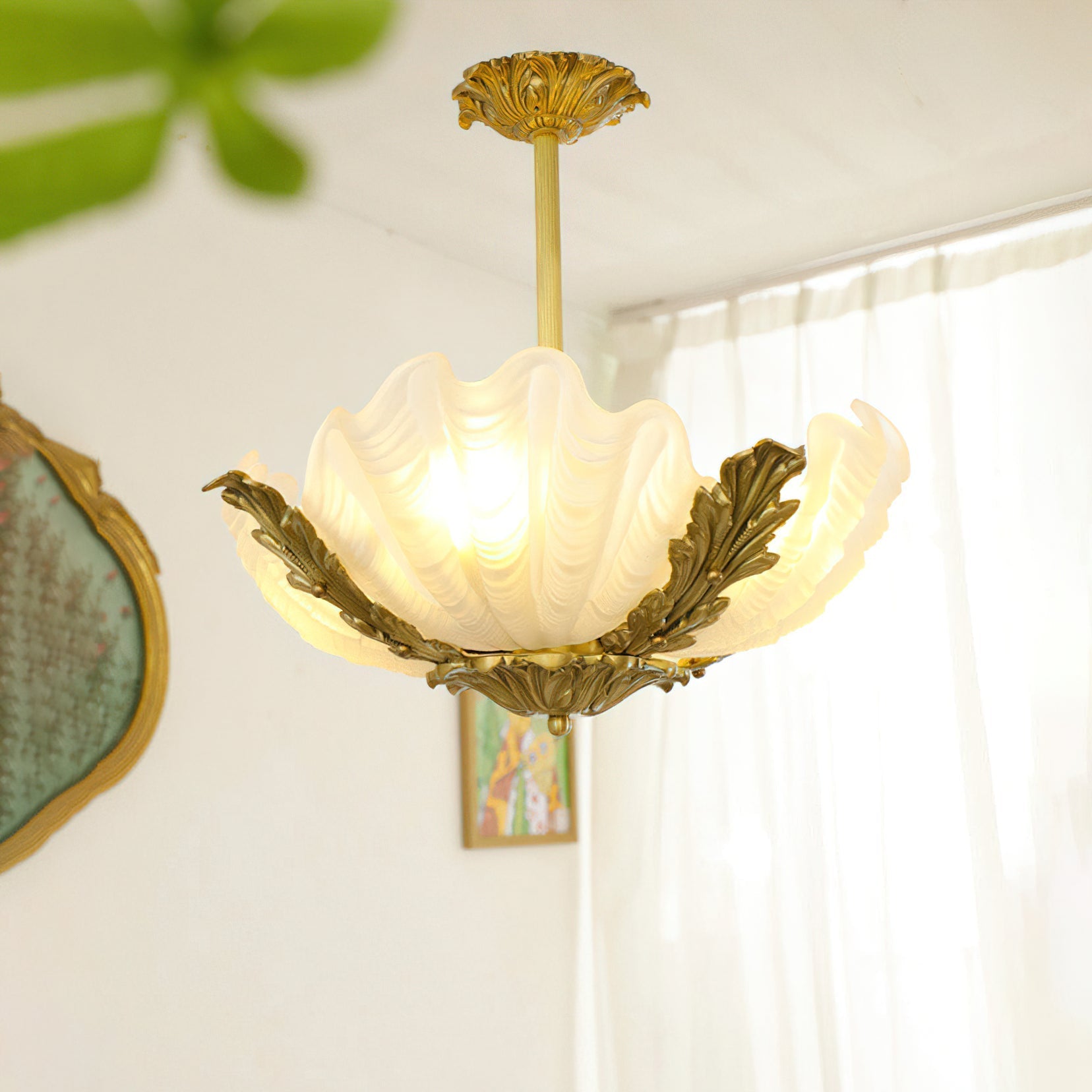 Lifestyle image of the Velmira lamp over a dining area.