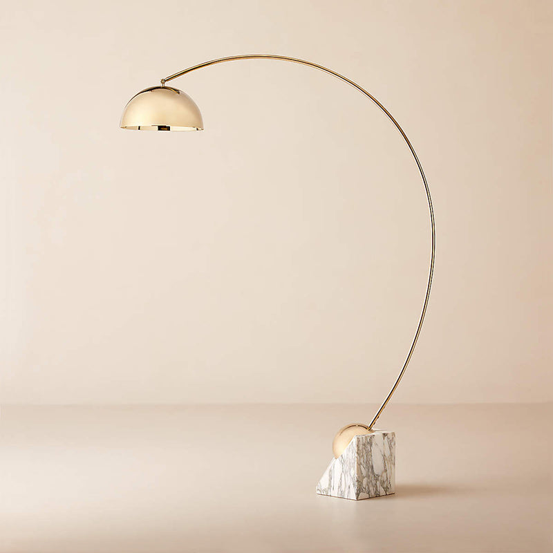 Angled view of the Venus Floor Lamp with gold finish, highlighting the brass arm.