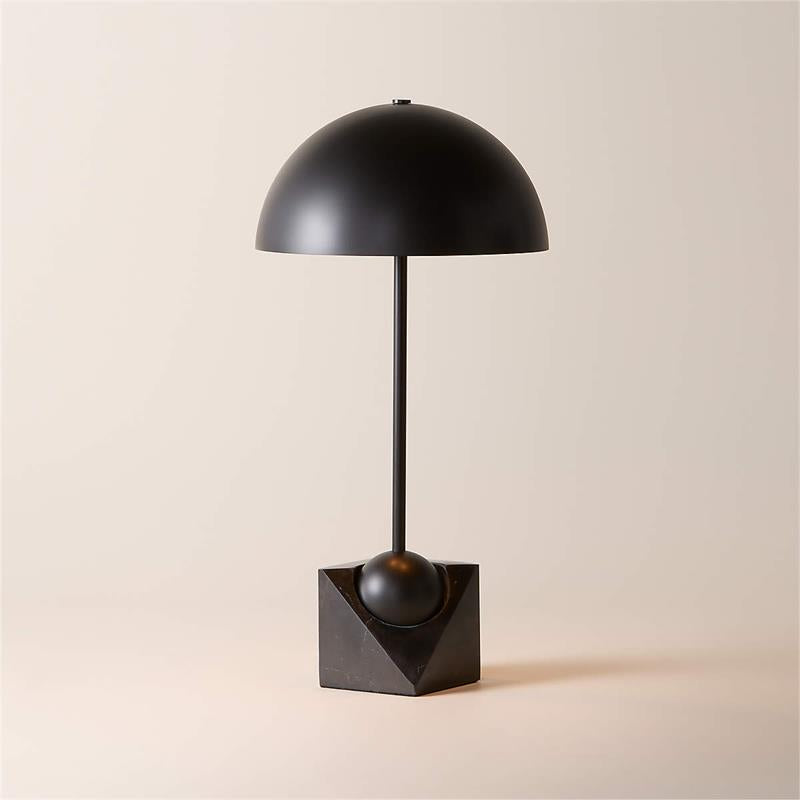 The Venus Table Lamp turned on, casting a warm glow.