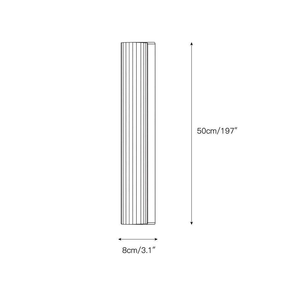 The wall sconce illuminated, casting a warm and inviting ambient light.