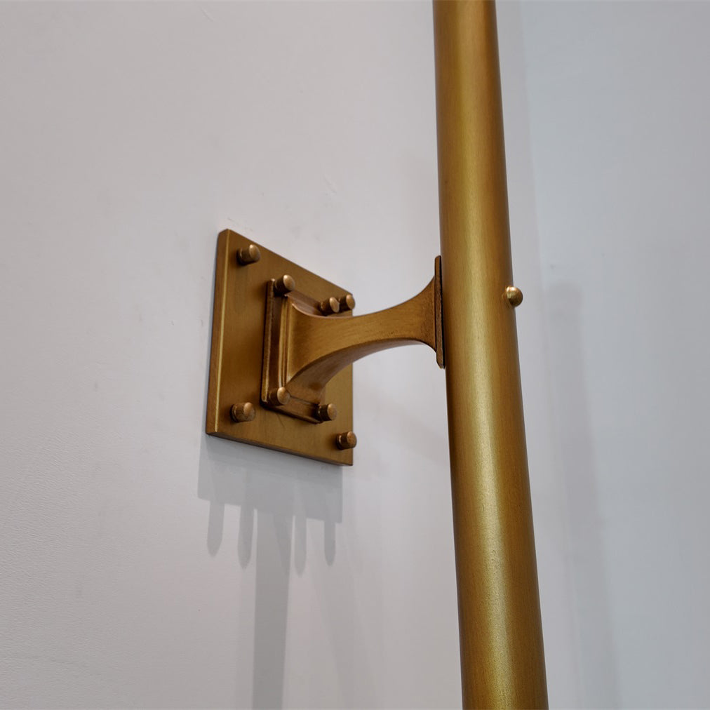 Front view of the Vesper Wall Lamp in brass.