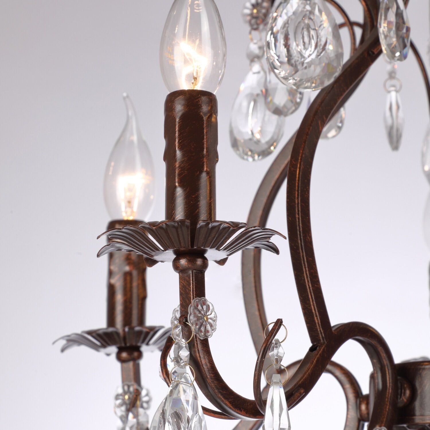 The antique red bronze finish texture on the metal frame.