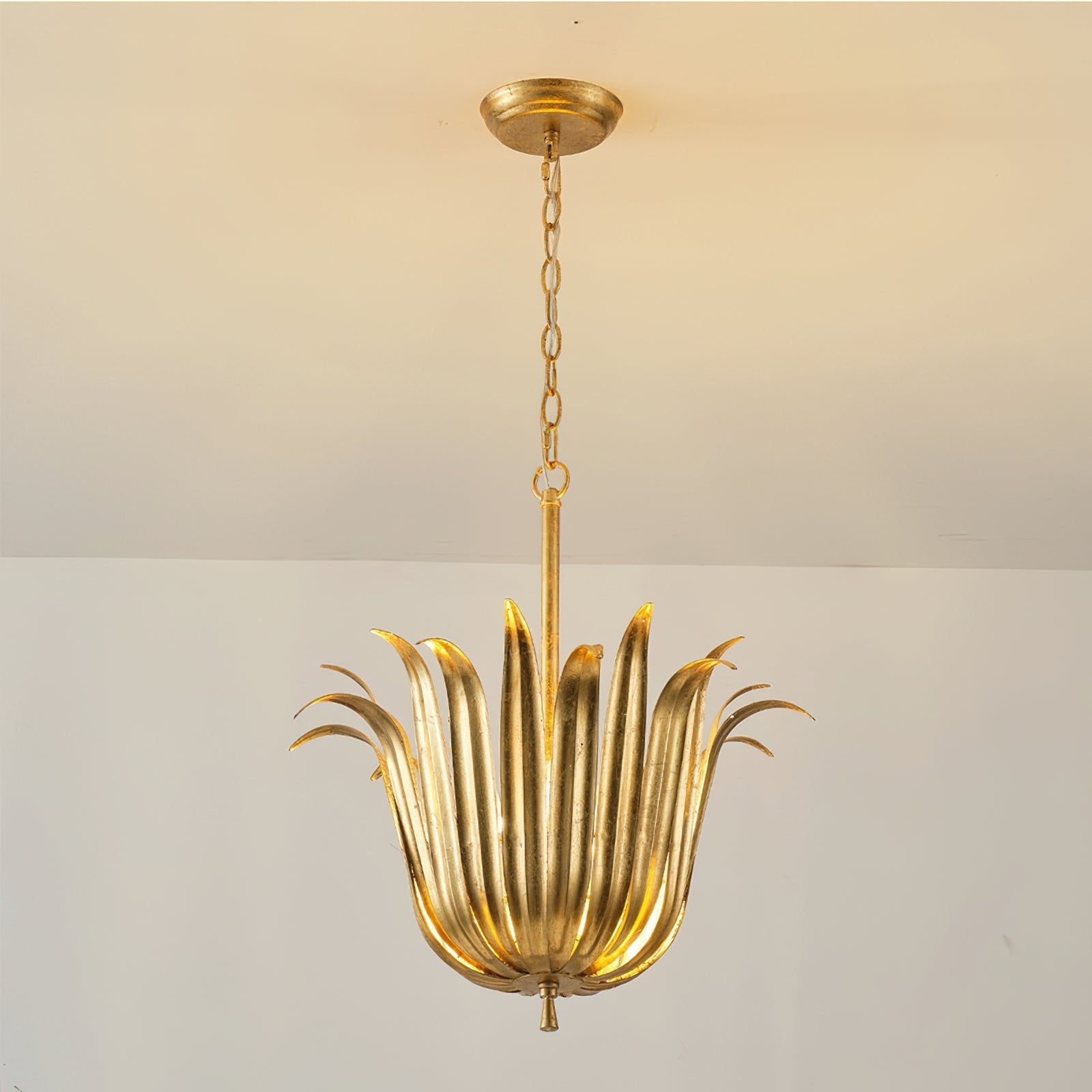 Close-up of the sculpted metal leaves on the Vicenzio pendant.