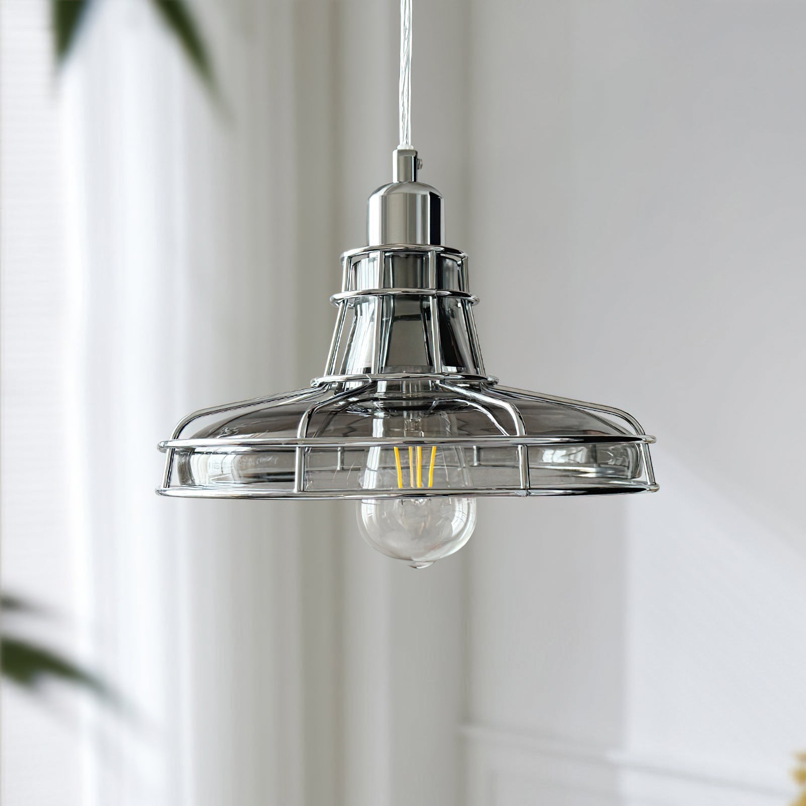 Close-up view of the Williston Pendant Light's metal and glass construction.