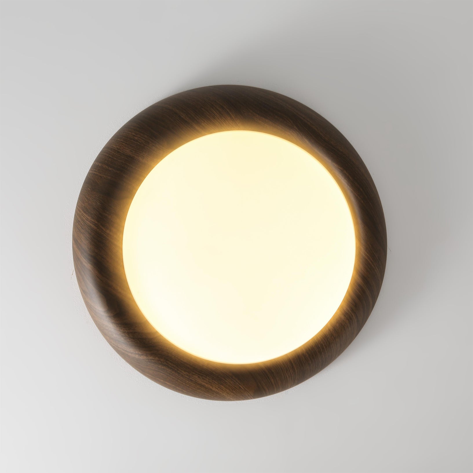 Vikaey Ceiling Light illuminating a contemporary dining area.