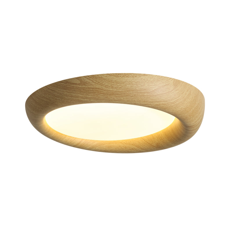 The ceiling light casting a soft, even light pattern on the ceiling.
