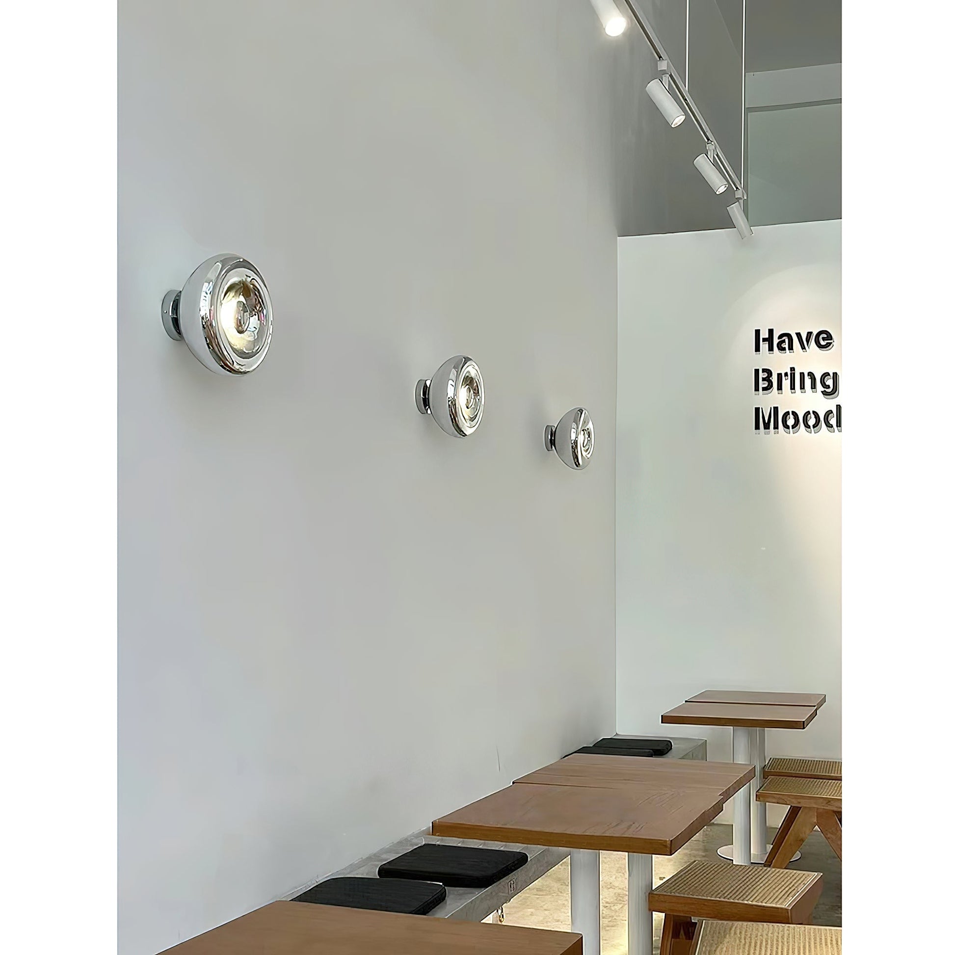 Angled view of the gold Void Surface Sconce, highlighting its sleek form.