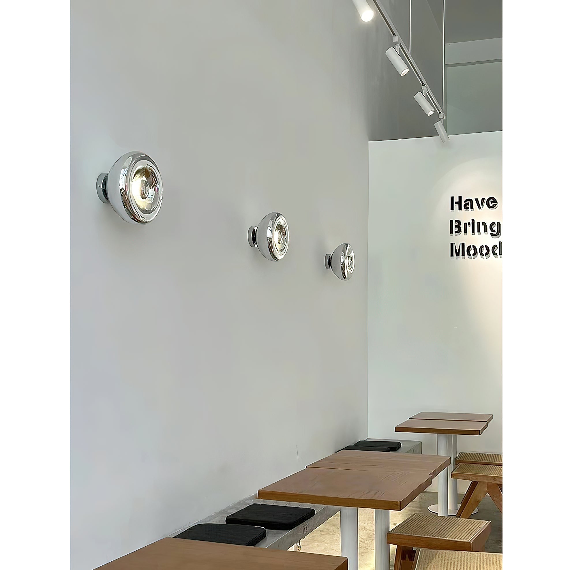 Angled view of the gold Void Surface Sconce, highlighting its sleek form.