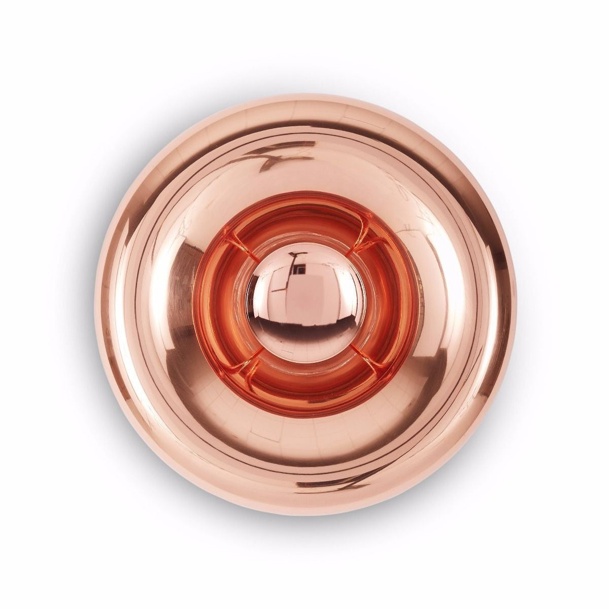 The rose gold Void Sconce casting ambient light in an entryway.