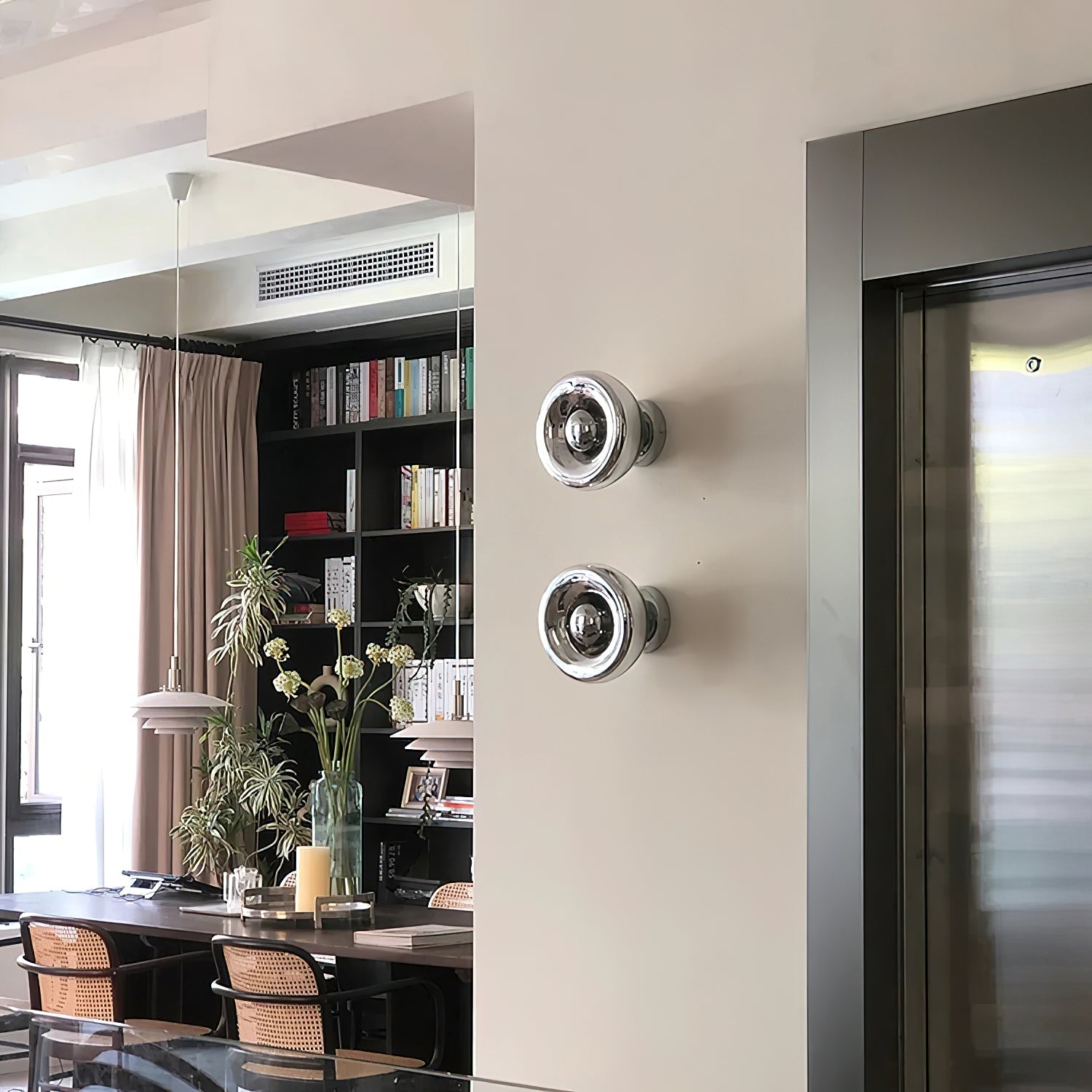 Side view of the modern Void Surface Sconce in rose gold.
