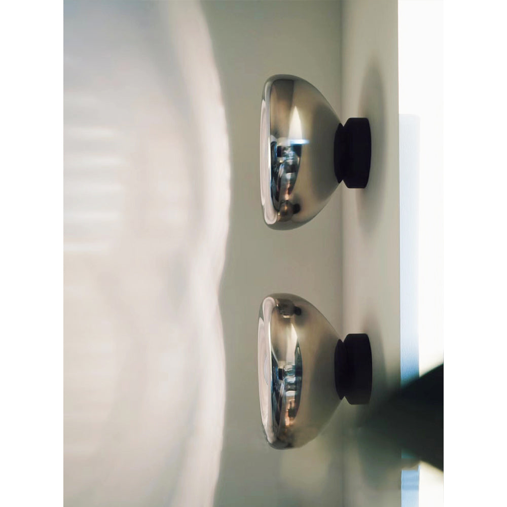 Detail shot of the chrome finish on the Void Surface Sconce.