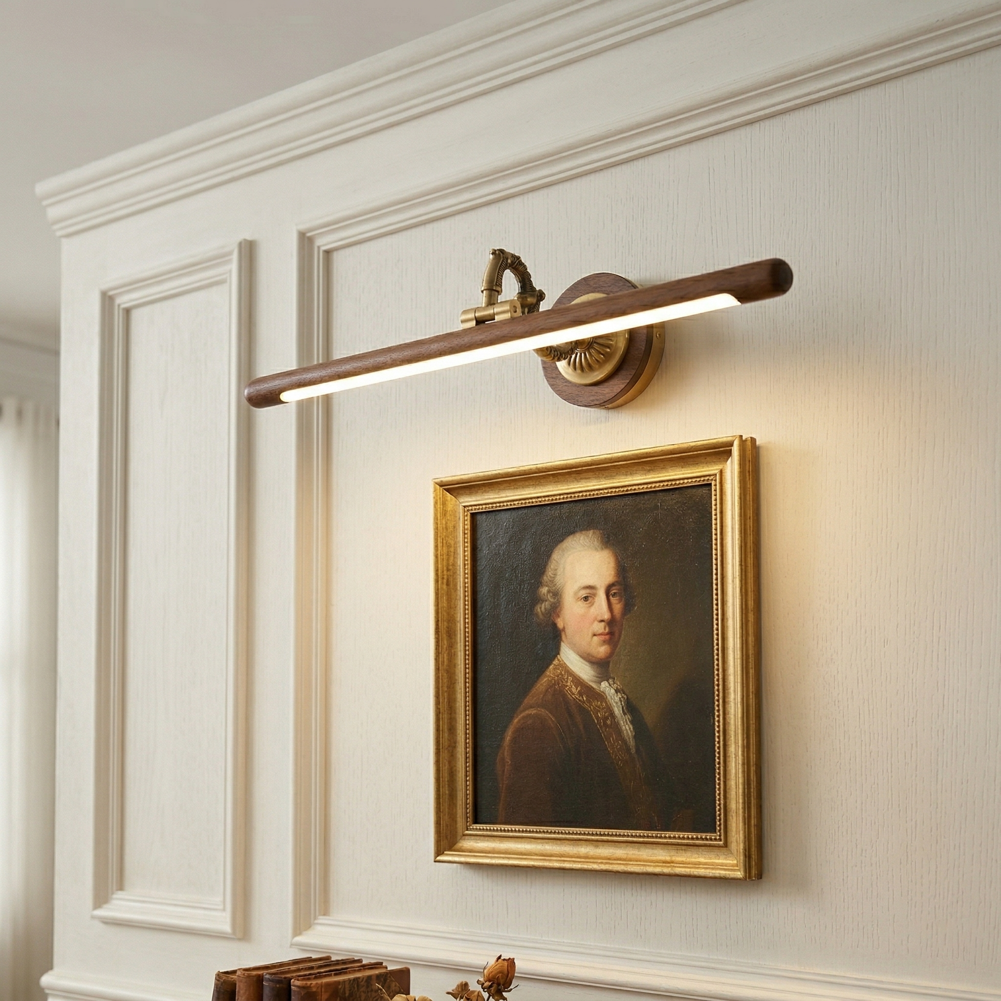 Close-up of the adjustable brass arm on the picture light.