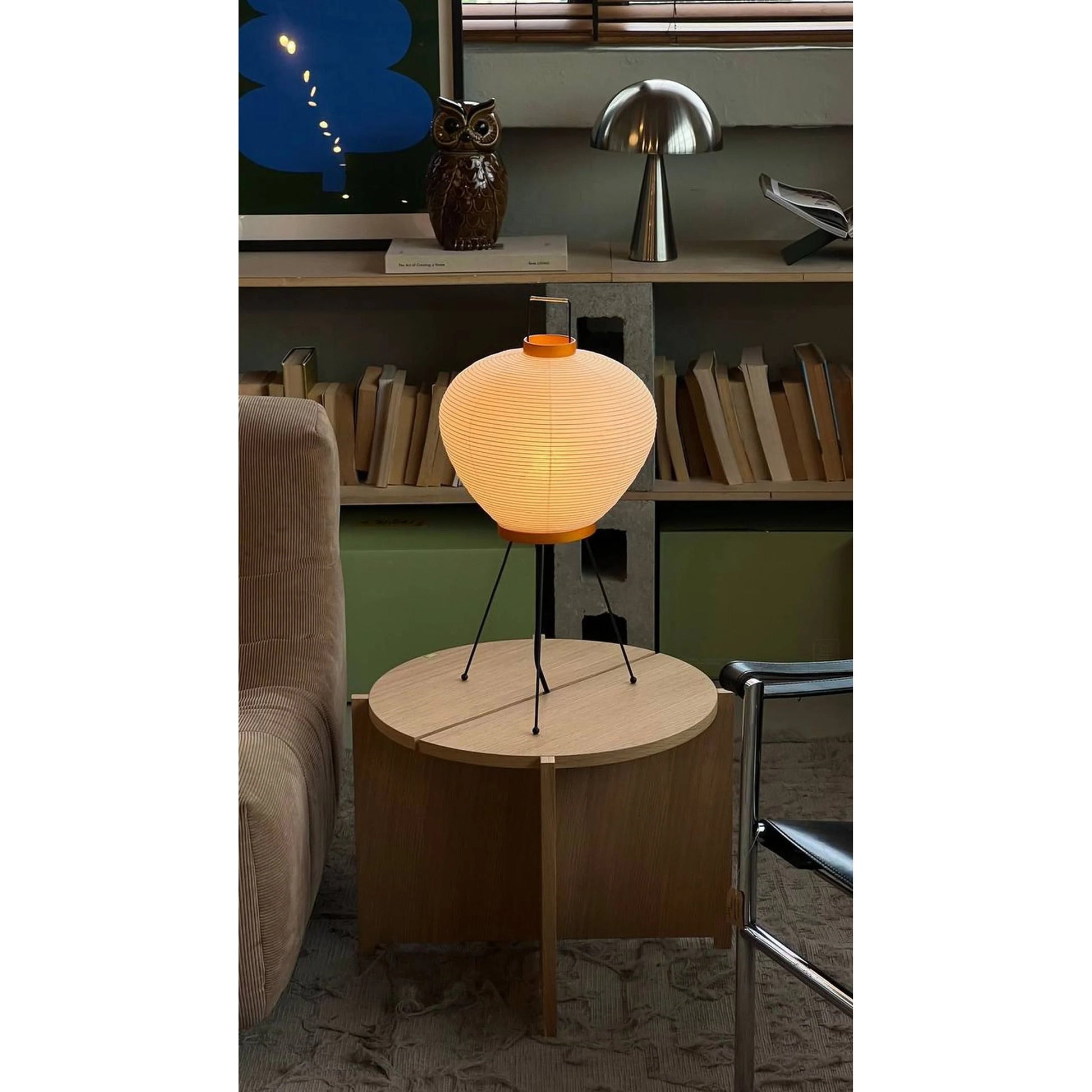 The lamp turned off, showing the contrast between the paper and metal.