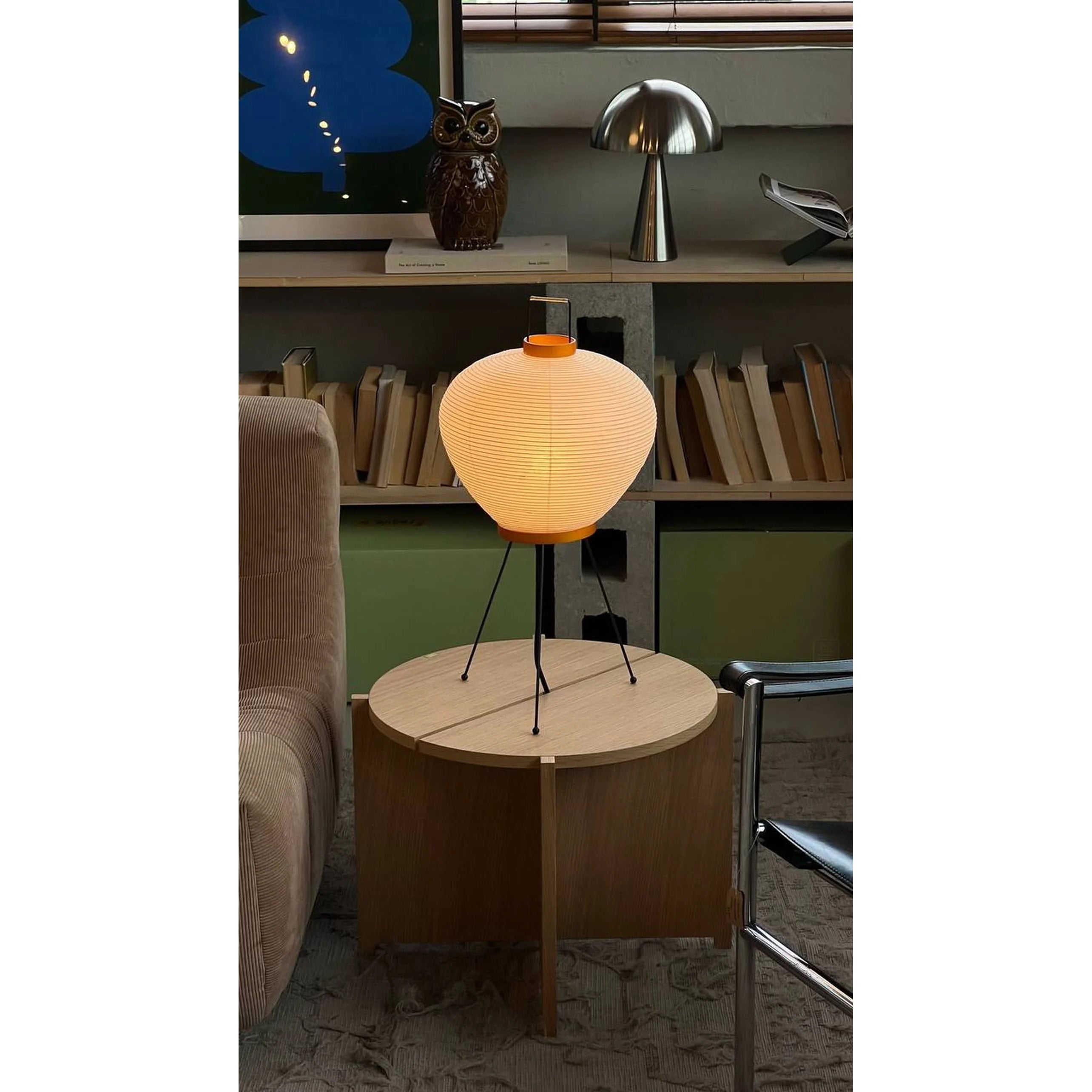 The lamp turned off, showing the contrast between the paper and metal.