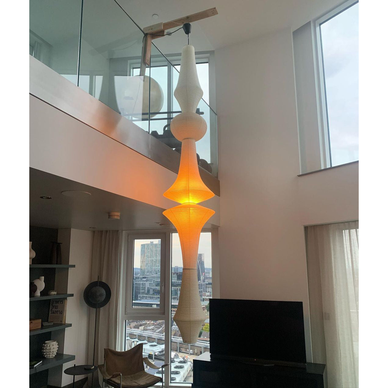 Installation detail showing the ceiling canopy and hanging wire.