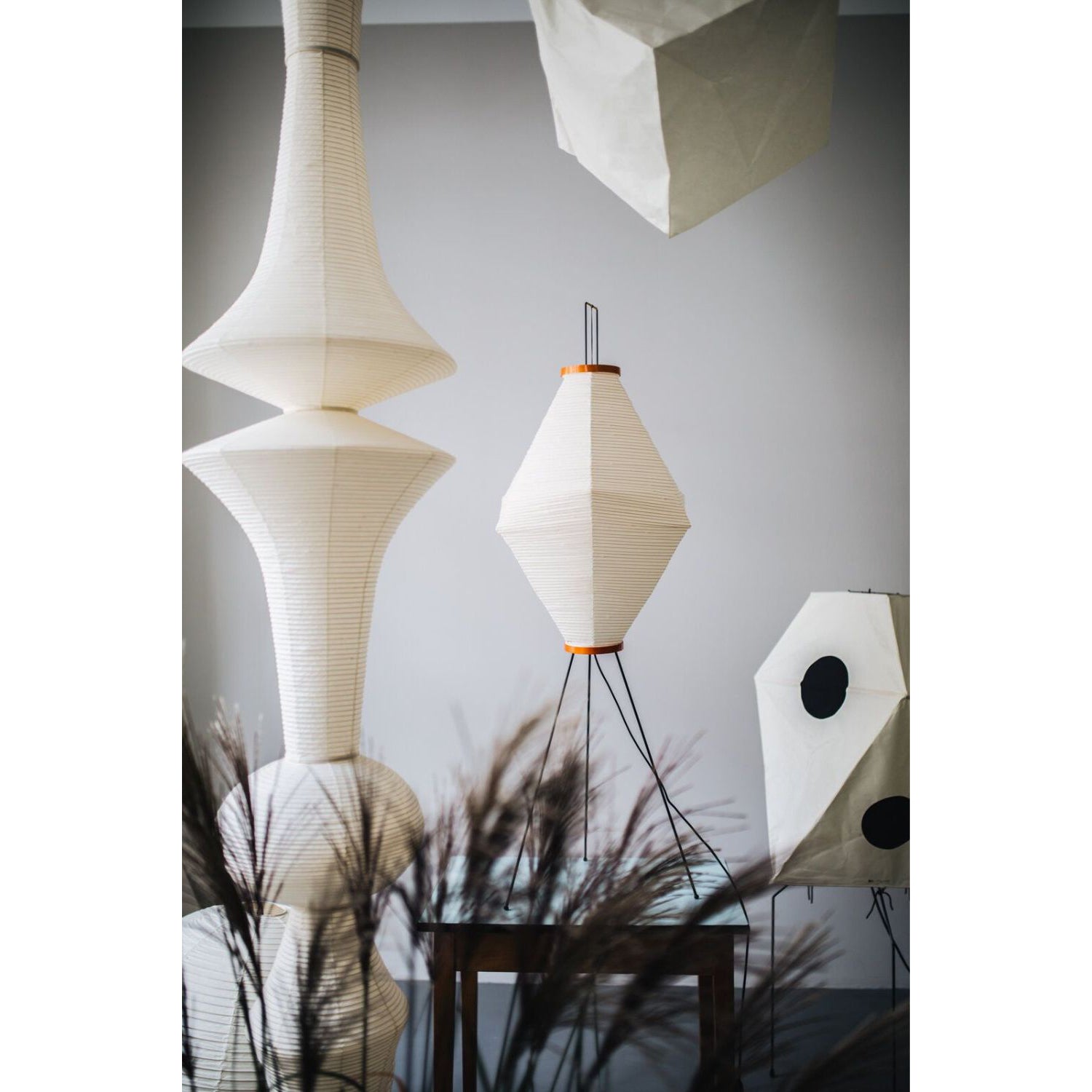 A single Washi Paper E Pendant Lamp in a hallway.