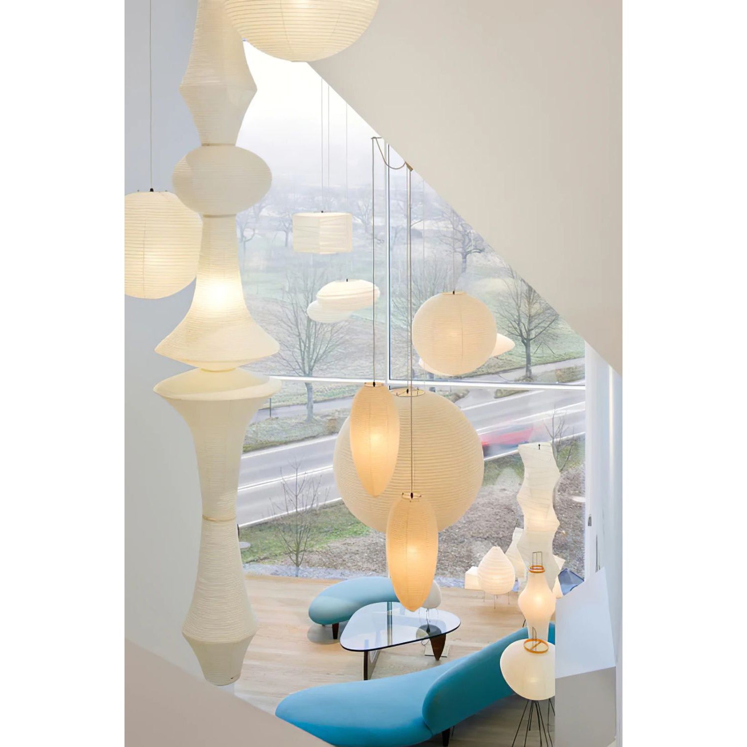 The Washi Paper E Pendant Lamp in a bedroom setting.