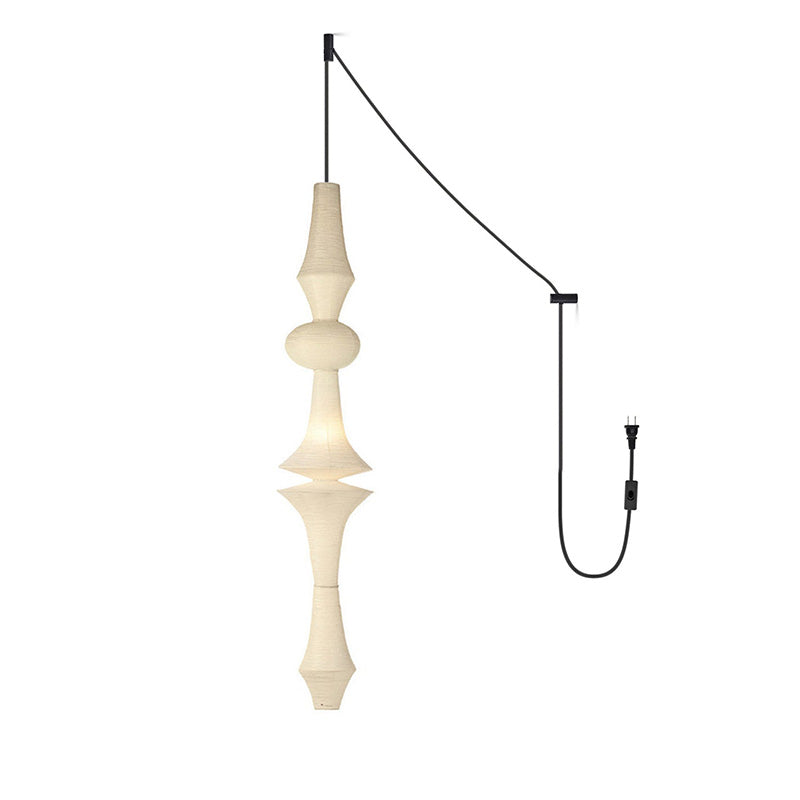 The pendant light used as a corner accent light in a bedroom.