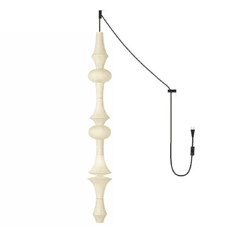 The pendant light casting a warm, inviting glow in an entryway.