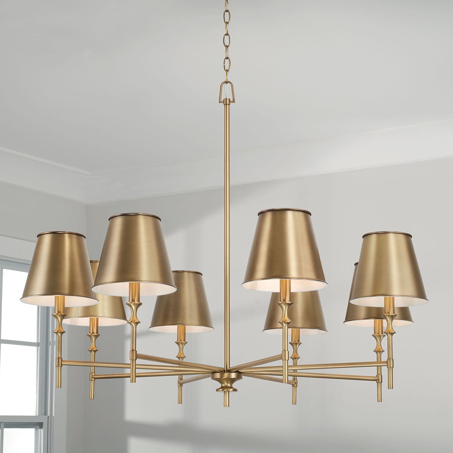 The chandelier illuminated, casting a warm and inviting glow.