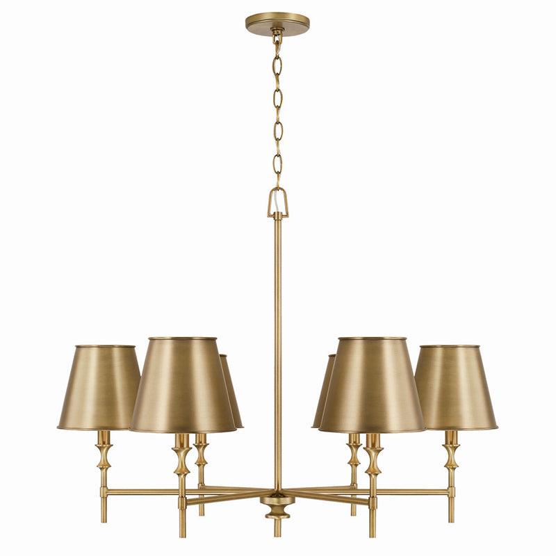 Whitney Brass Chandelier styled above a classic dining table.