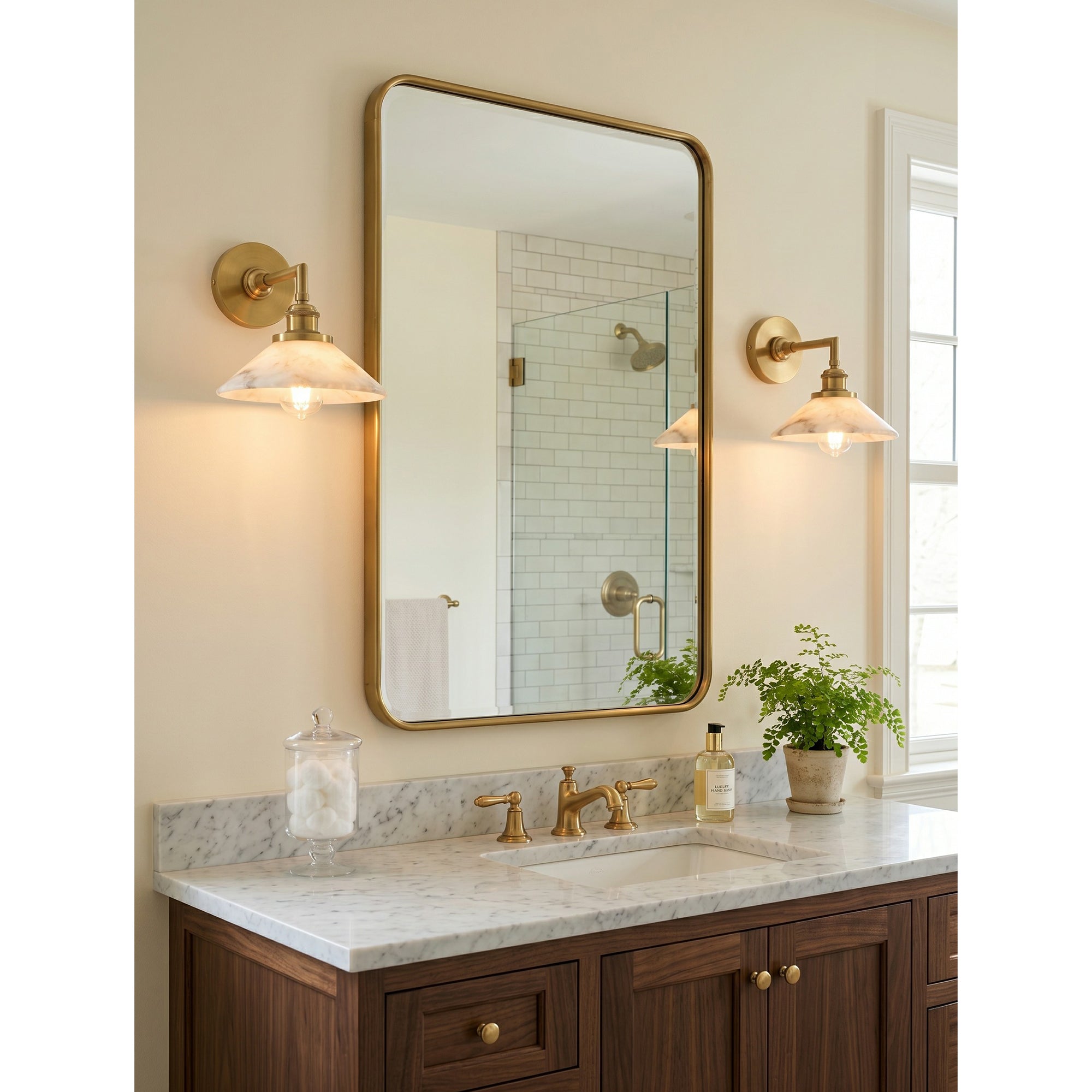 The sconce installed above a console table in an entryway.