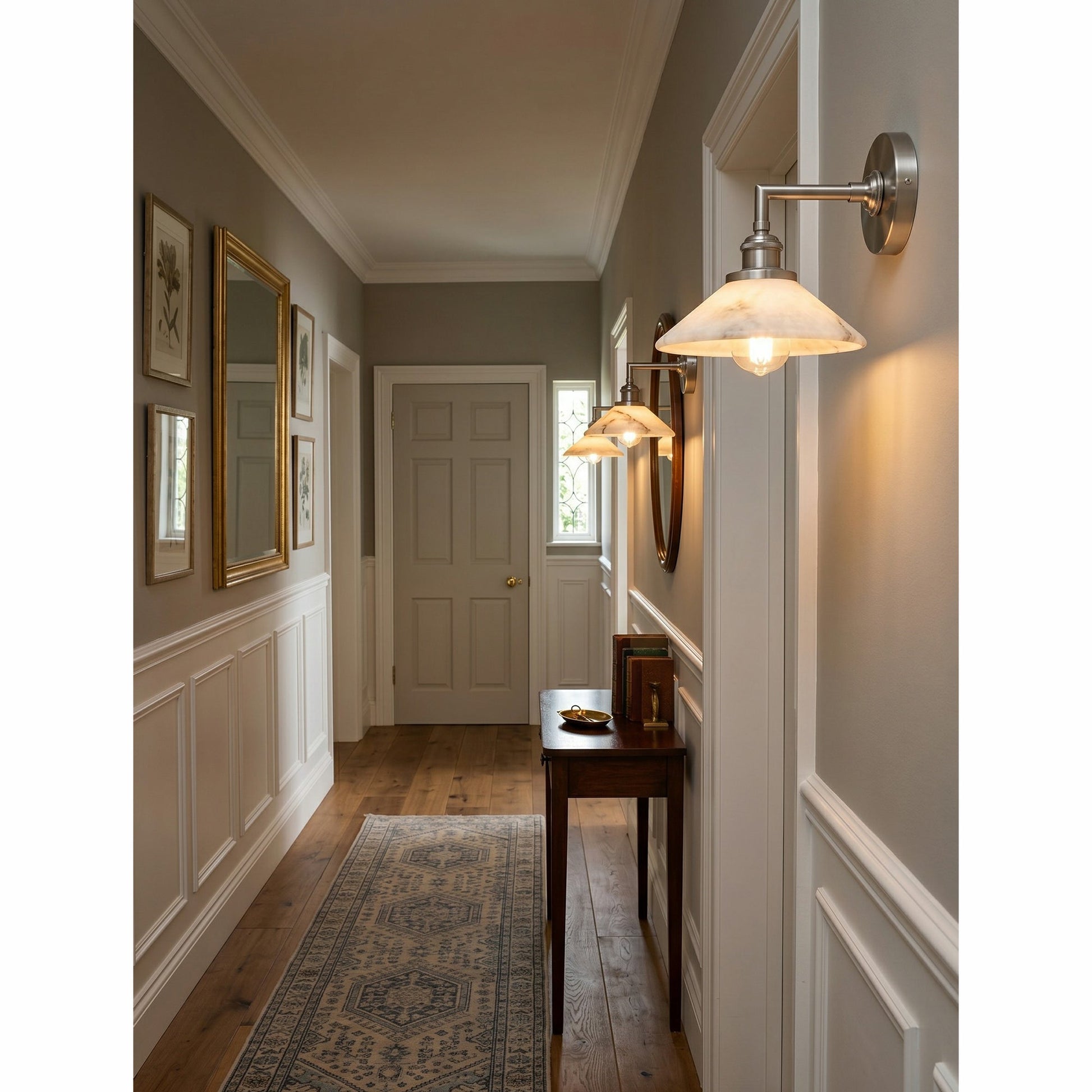 The brass finish sconce in a transitional style room.