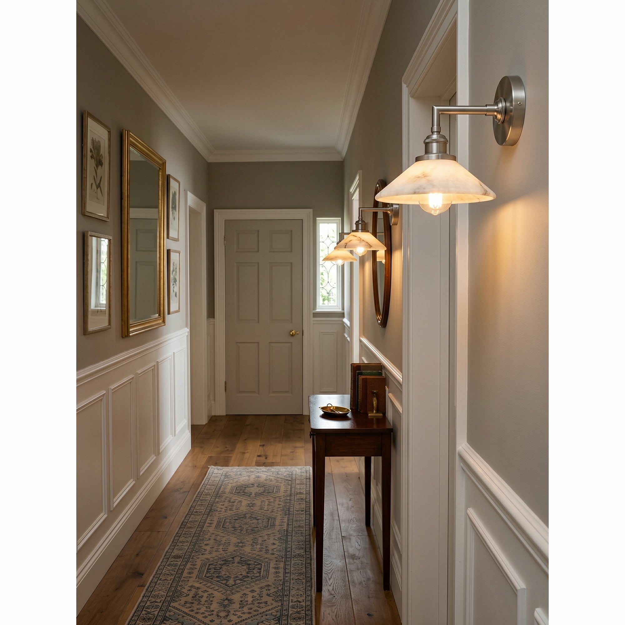 The brass finish sconce in a transitional style room.