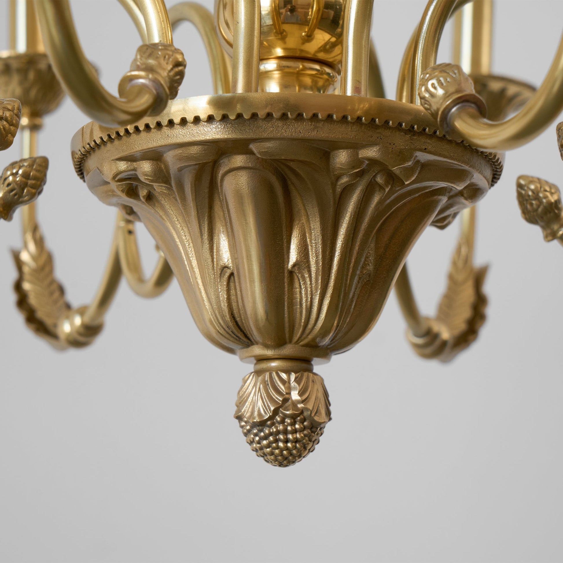 The chandelier's arms curving gracefully outwards.