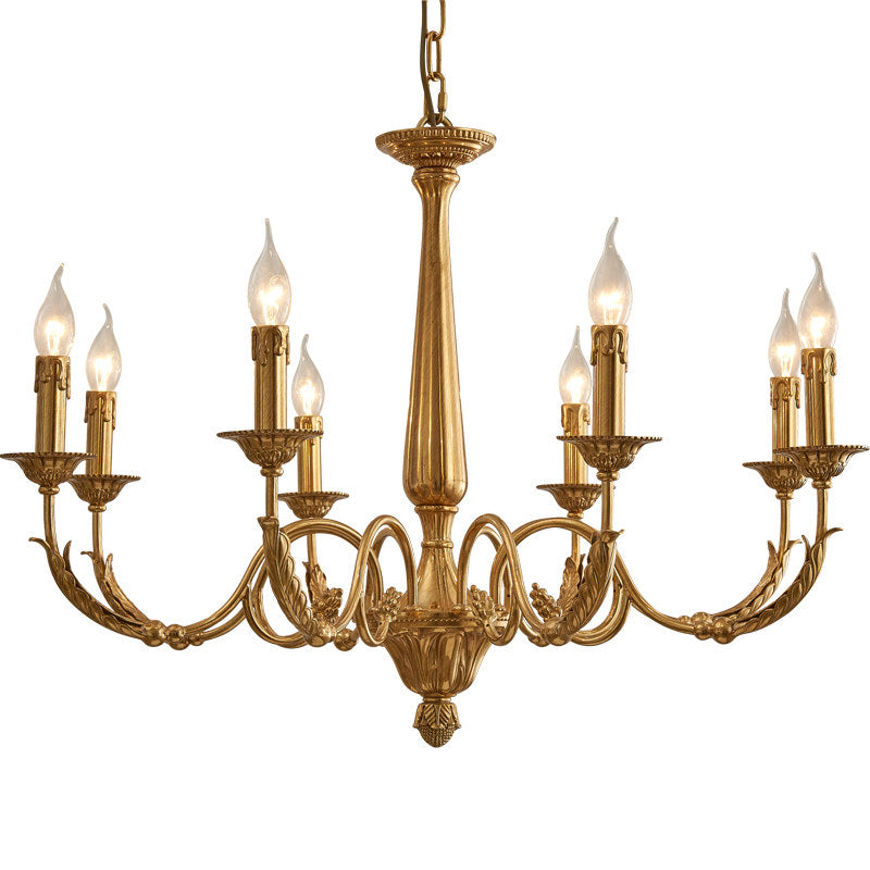 The brass chandelier illuminating a formal dining area.