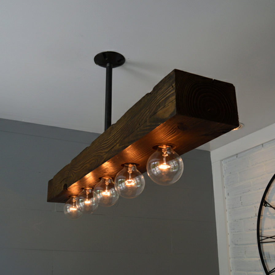 Full view of the wood beam chandelier in a spacious room.