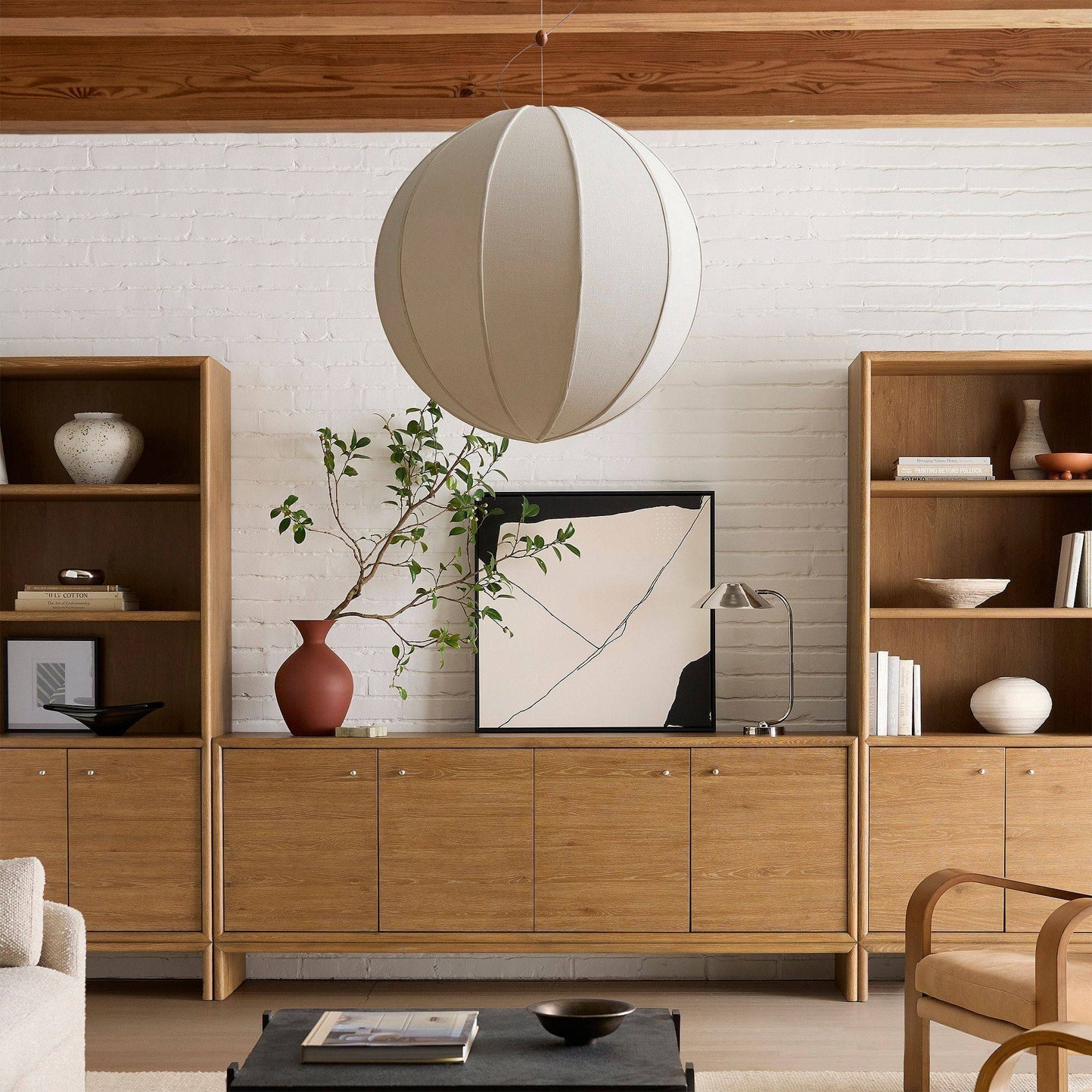 Yaratam Pendant Light displayed in a minimalist bedroom setting.
