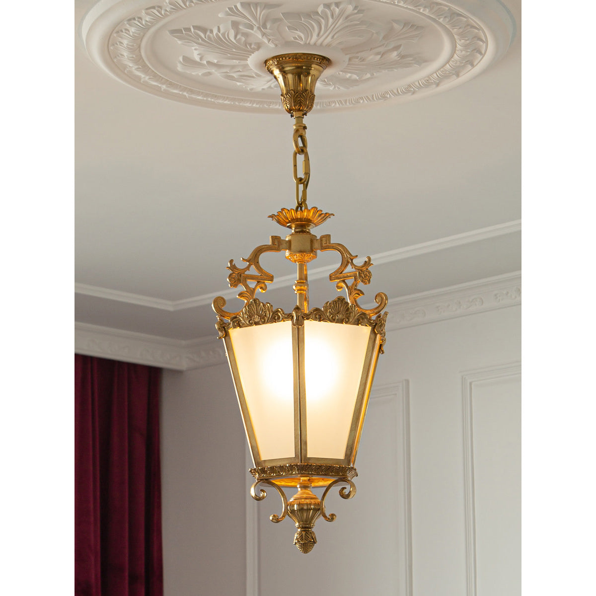 Angled view of the brass lantern pendant, showcasing its vintage design.