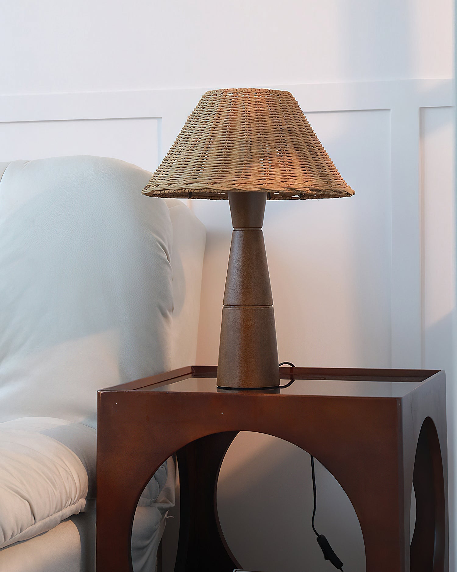 Zaya Table Lamp providing ambient light in a dimly lit room.