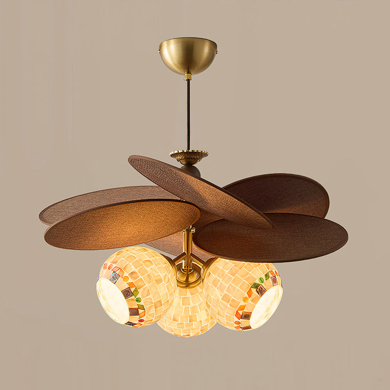Top-down view of the brushed brass metal frame and raffia shade.