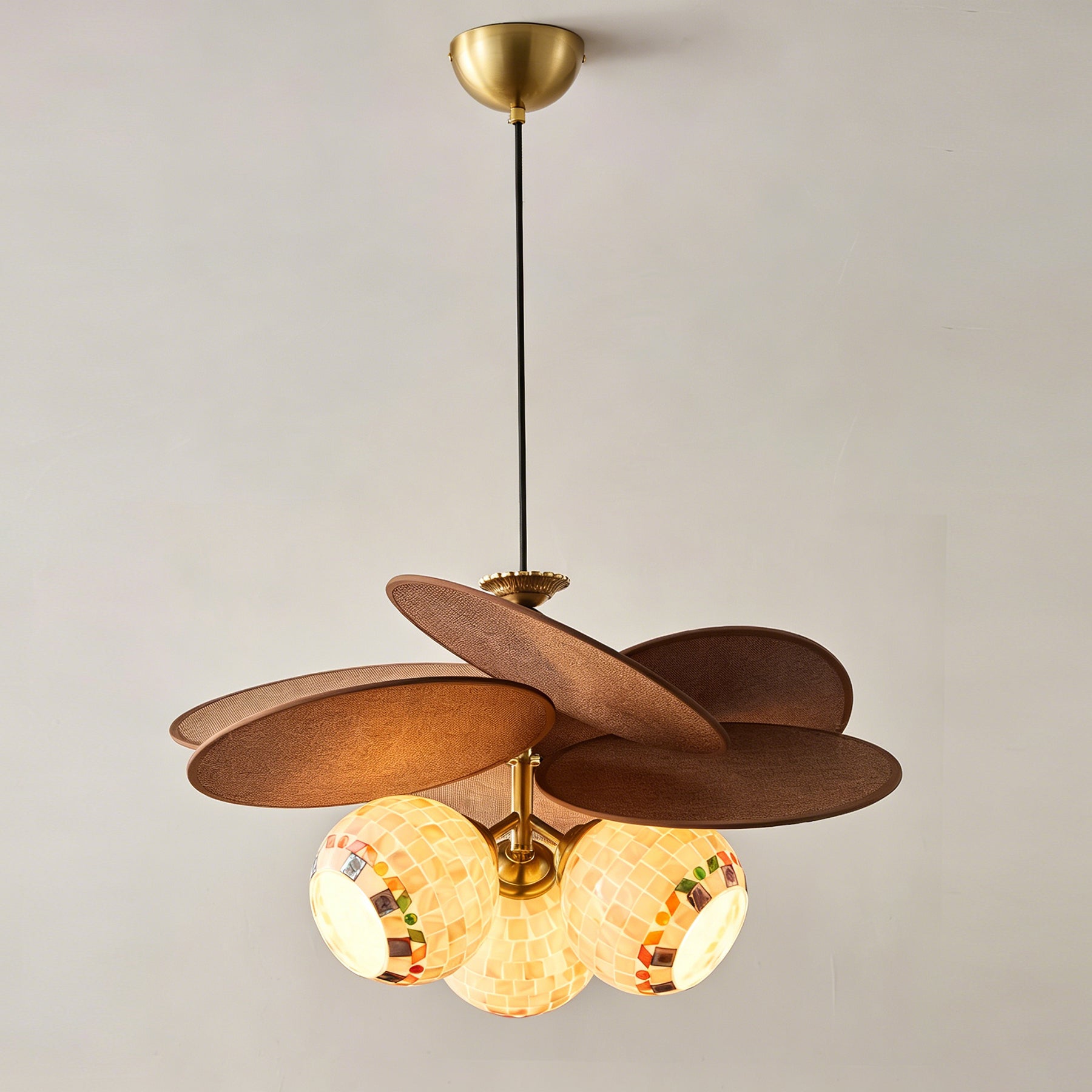 The suspension rod and ceiling mount detail of the chandelier.