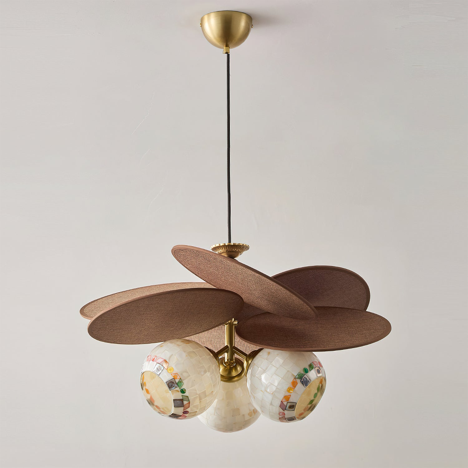 Lifestyle image showing the chandelier's scale in a dining room.
