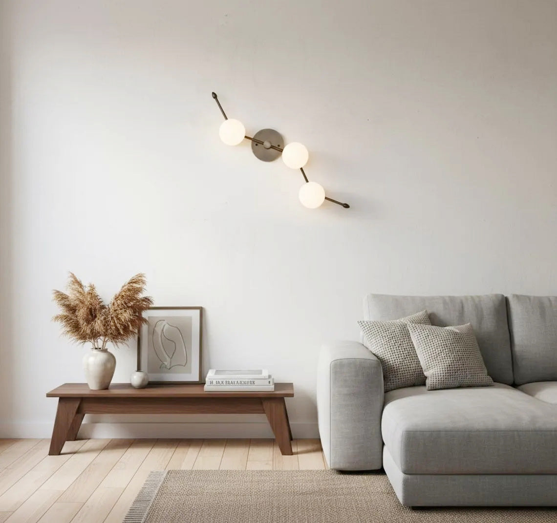 The Zodiac Wall Lamp viewed from the front, highlighting its symmetrical design.
