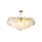 Celestia Cloud Glass Chandelier in a modern dining room setting.
