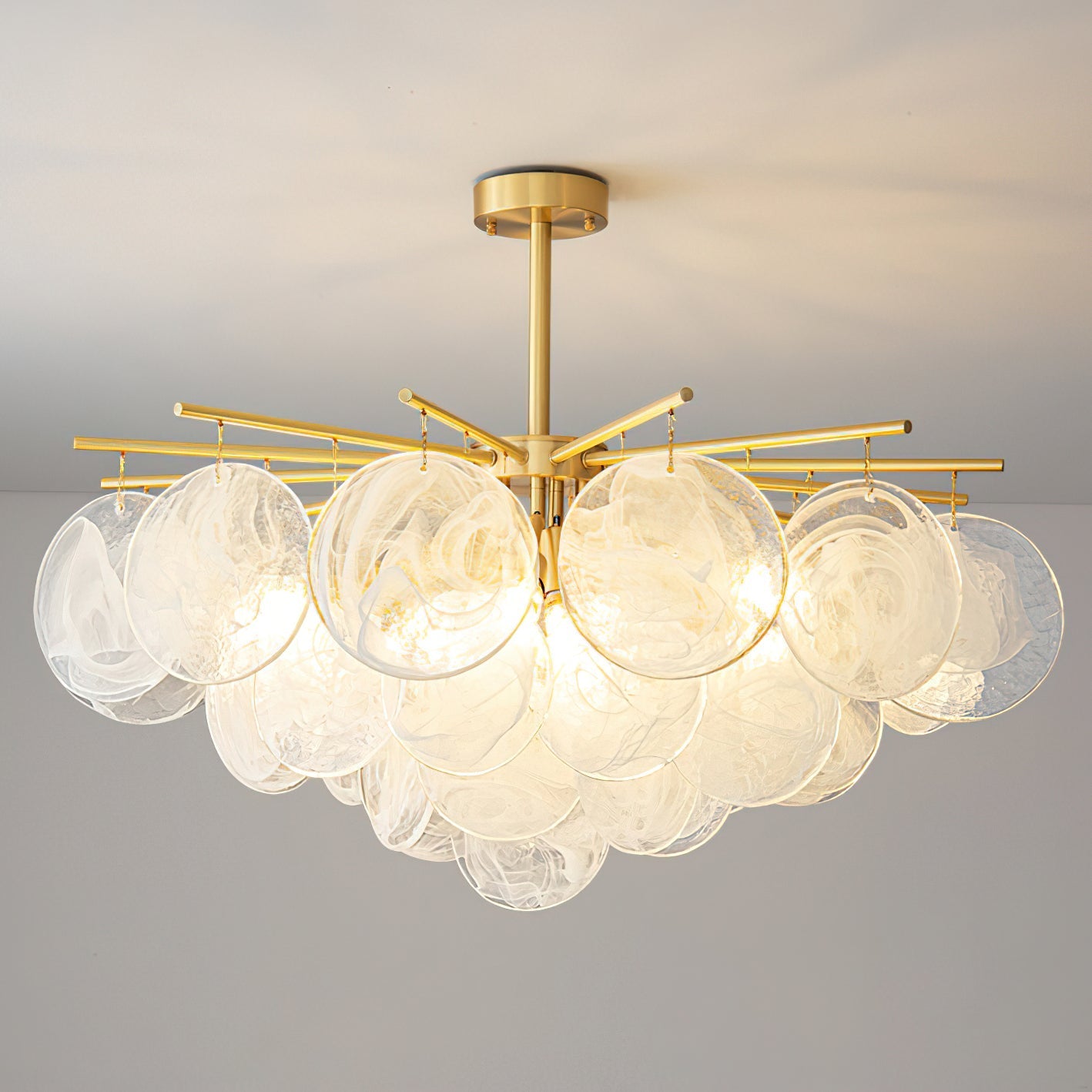 Close-up of the hand-blown swirled glass discs on the Celestia Chandelier.