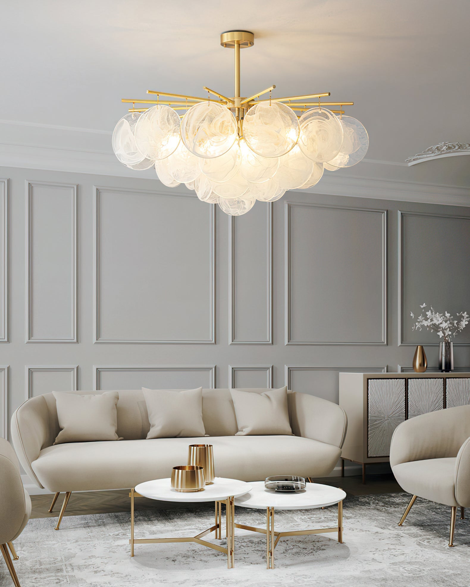 The Celestia Chandelier in gold finish, showing the brass starburst frame.
