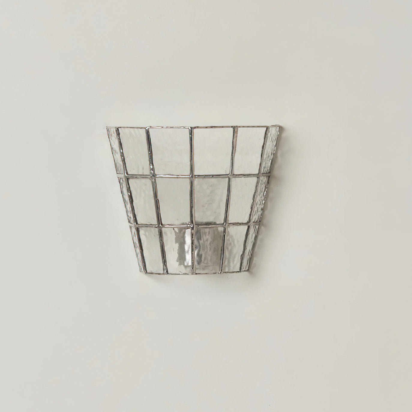 Zola Glass Sconce providing accent lighting in a stylish interior.