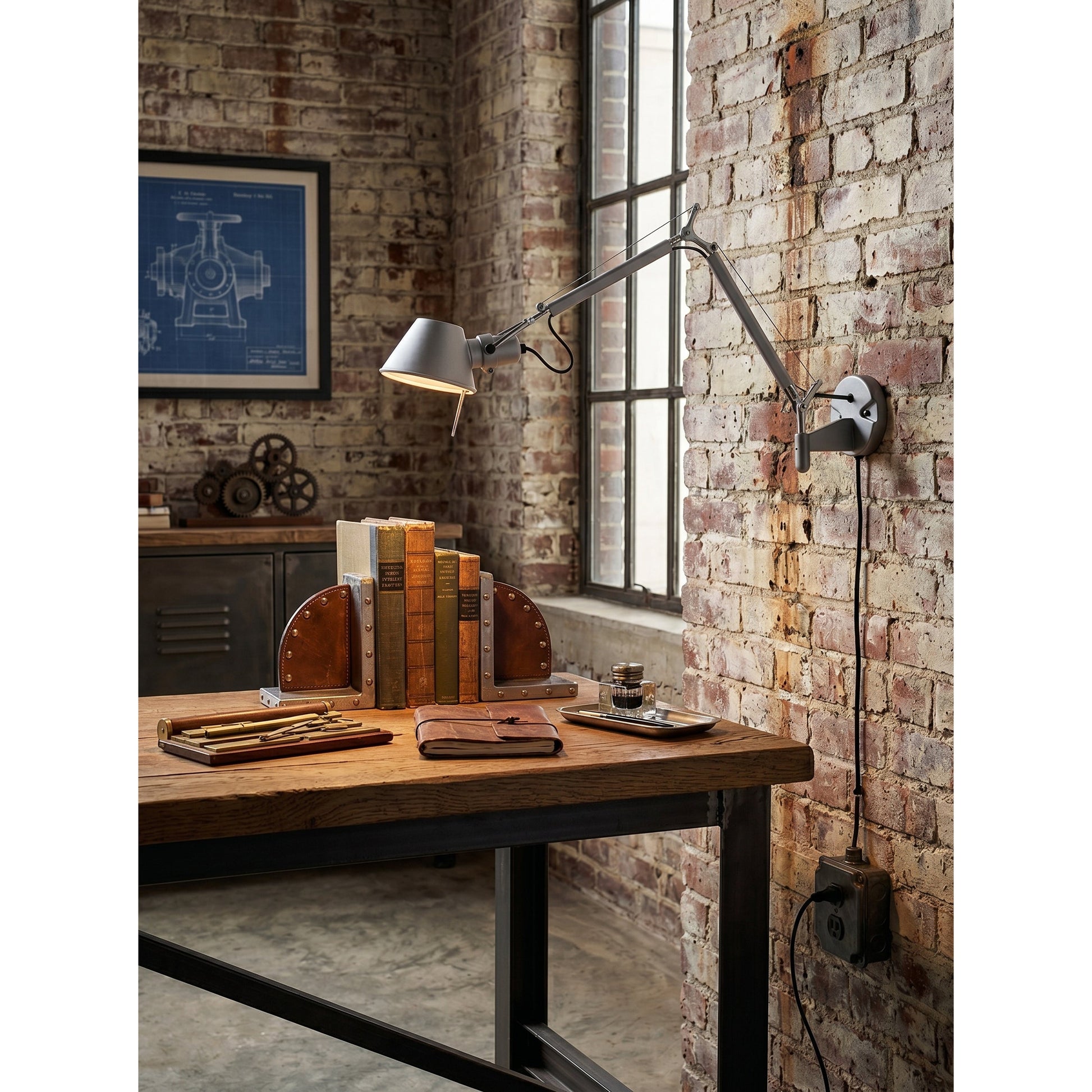 The Brady sconce from a low angle, emphasizing its modern form.
